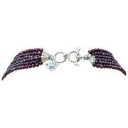 Collar Magnolia Calavera, joya de plata .925, con granate y concha – Gabriela Sánchez (vista 4)