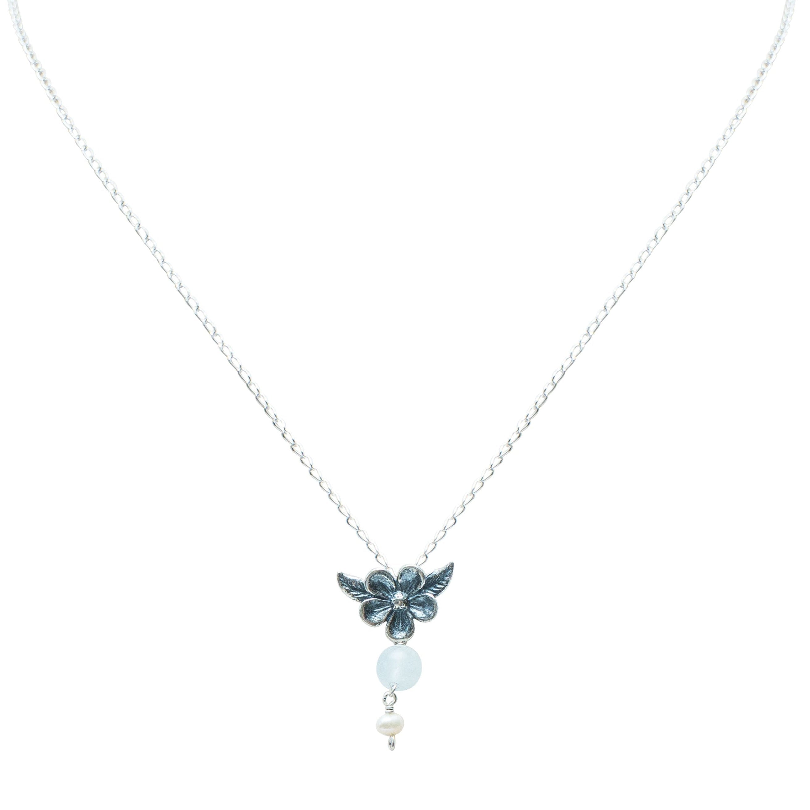 Dije Flores de Amor, joya de plata .925, con aquamarina y perla – Gabriela Sánchez