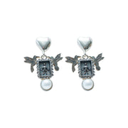 Aretes Alas de Ternura, joya de plata .925, con perla – Gabriela Sánchez