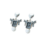 Aretes Alas de Ternura, joya de plata .925, con perla – Gabriela Sánchez (vista 3)