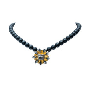 Collar Kukulcán Dorado, joya de plata .925, con obsidiana – Gabriela Sánchez