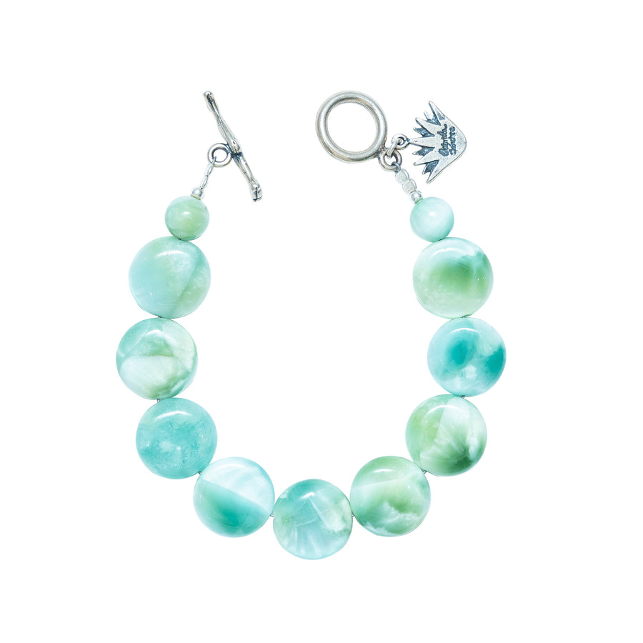 Pulsera Fiesta en el Agua, joya de plata .925, con angelita verde – Gabriela Sánchez
