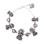 Pulsera Cinco Muñequitas, joya de plata .925 – Gabriela Sánchez